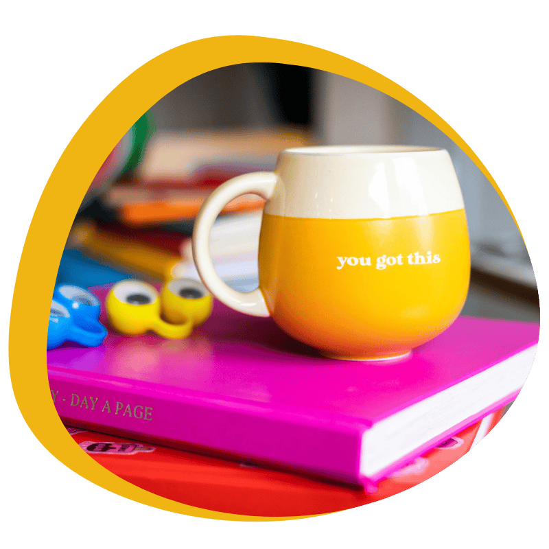 Motivational Yellow Mug On Books